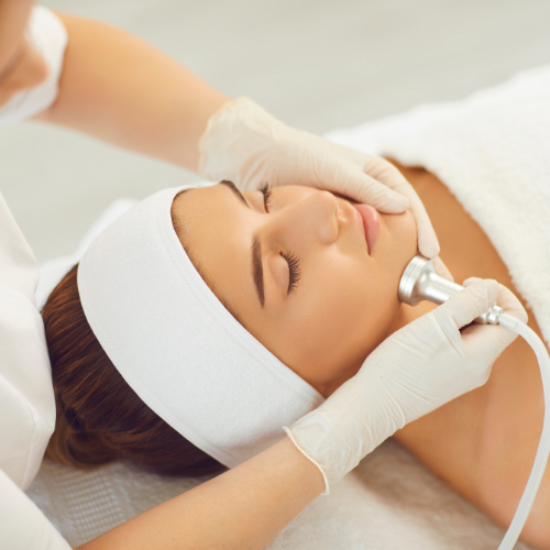 woman having facial treatment, hair removal treatment