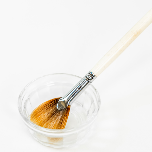 facial brush in small bowl