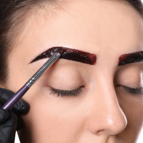 woman having brow tinting treatment brow tint