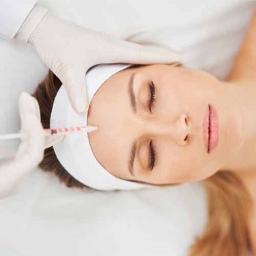 woman having botox fillers treatment on forehead