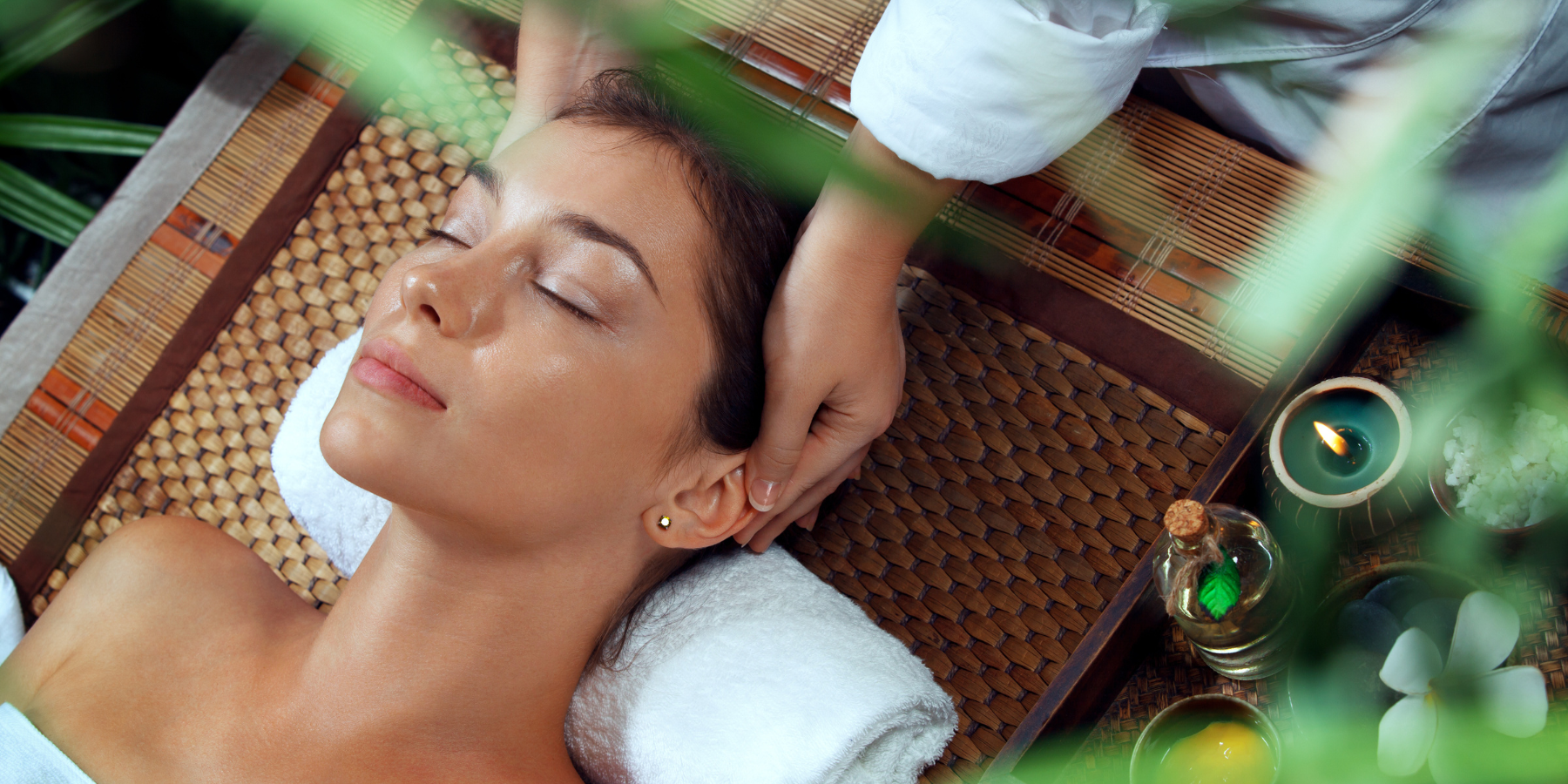 woman having facial massage on spa